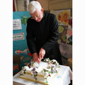 Tercentenary 2008 - Fr Duncan cutting cake